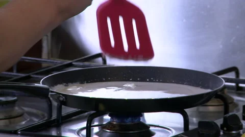Swirling Batter Around a Pan with a Spatula Stock Footage 59356926