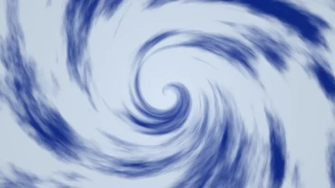 Swirling blue clouds creating a vortex pattern in the sky Stock Footage 338011400