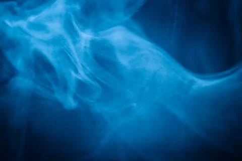 Swirling blue smoke patterns creating an ethereal and dreamy abstract effect Fotos Stock