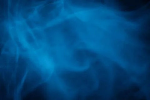 Swirling blue smoke patterns creating an ethereal and dreamy abstract effect Stock Photos