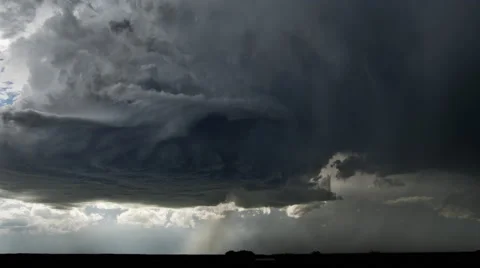 Swirling dark gray supercell cloud with lightning and rain over a prairie Stock-Footage 59513713