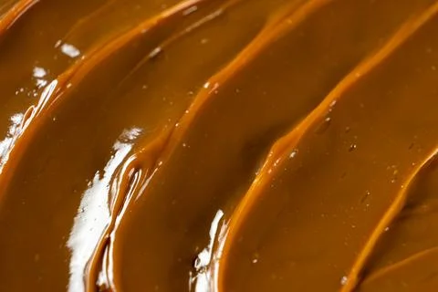 Swirling dulce de leche pattern close up for dessert. Stock Photos
