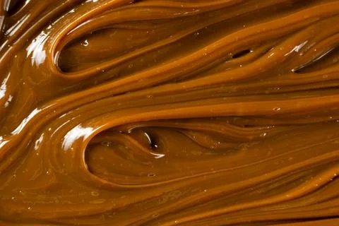 Swirling dulce de leche pattern close up for dessert. Stock Photos