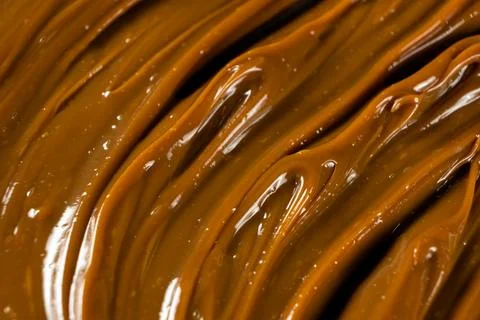 Swirling dulce de leche pattern close up for dessert. Stock Photos