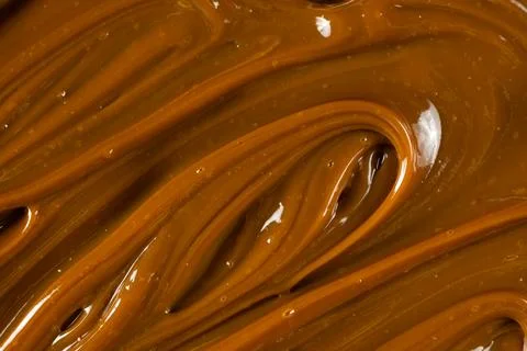 Swirling dulce de leche pattern close up for dessert. Stock Photos