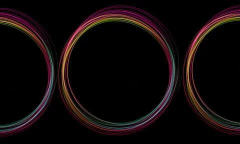 Swirling freeze light circles create a colorful effect against a dark backg.. Stock Illustration