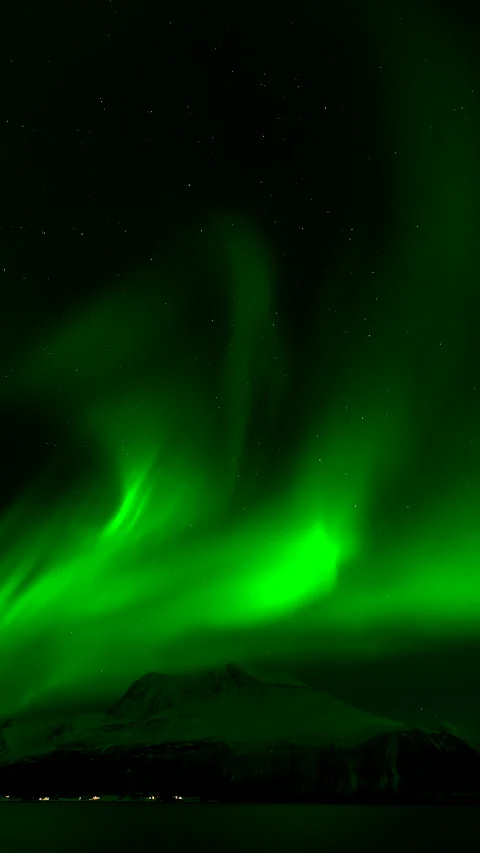 Swirling Green Aurora Borealis Time Lapse Above Snowy Mountain at Night Stock Footage 346050071
