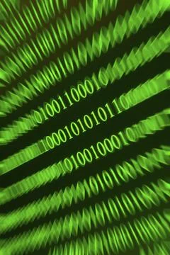 Swirling green binary numbers with blurring, techno-like representation Stock Photos