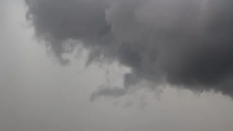Swirling grey thunderhead clouds showing turbulent atmospheric weather patterns Stock Footage 345654168