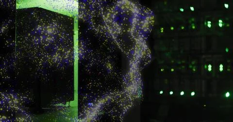 Swirling luminous particle cloud moving across tech interior, passing lit green Stock Photos
