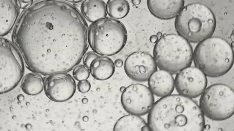 Swirling microscopic white bubbles and fluid Stock Footage 45768272