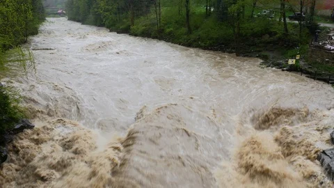 Swirling mountain river in the rain Stockbeeldmateriaal 109153834