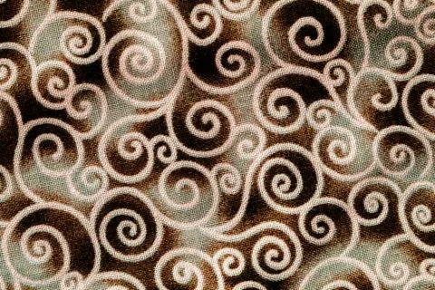Swirling pattern in older textile Stock Photos