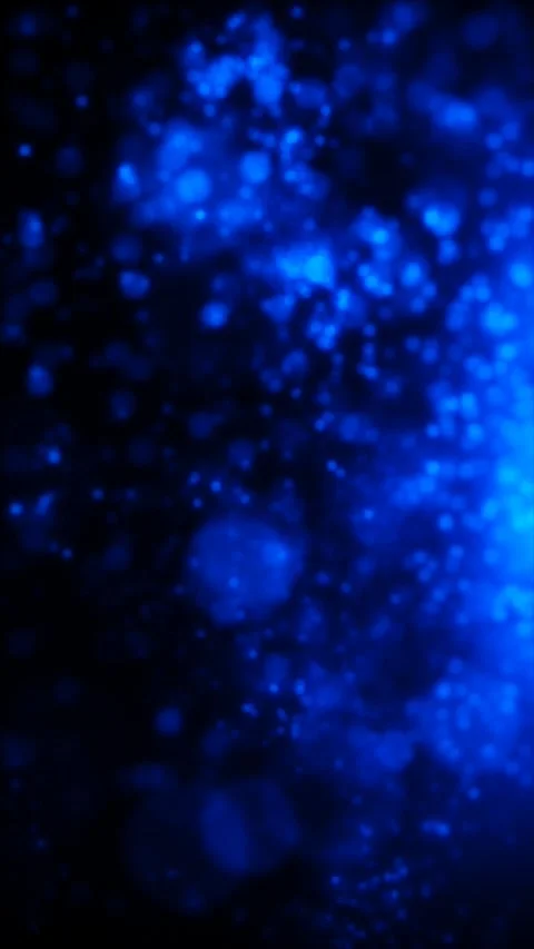 Swirling patterns of blue glowing particles in the dark night ocean Stock Footage 329297443