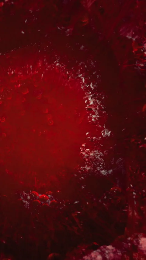 Swirling red patterns observed in dark surroundings during a creative project Vidéo 332212173