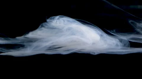 Swirling smoke creates captivating patterns under subtle lighting. Stock Footage 274137860