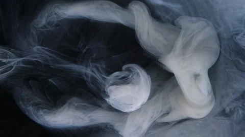 Swirling smoke creates captivating patterns under subtle lighting. Stock Footage 274199562