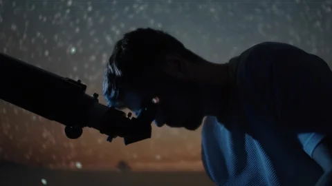 Swirling stars in the sky effect with man looking in the future with telescop Stock Footage 107360812