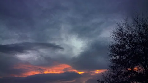 Swirling Storm Cloud Sunset Timelapse With silhouette Tree 스톡 동영상 151365490