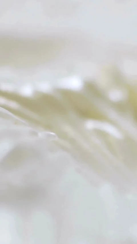 Swirling texture of smooth glossy white cream surface Stock Footage 334169229