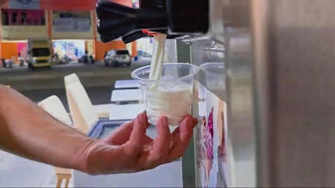Swirling Vanilla Soft Serve with Ice Cream Machine Stock Footage 286082275