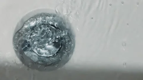 Swirling Water Drain Close-Up Video stock 287996733