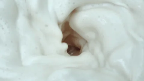 Swirling White Foam Vortex Close-Up, Creamy Texture Macro Stock Footage 348088520