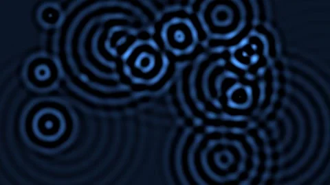 Swirls of blue circles on a dark background create a flow Stock Footage 338131796