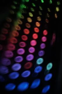  swirly  colorful rounded lights pattern  on black   Stock Photos