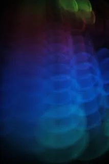  swirly  colorful rounded lights pattern  on black   Stock Photos