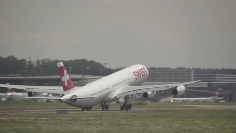 Swiss Airbus A340 Passenger Airplane Take Off, Zurich Airport, Heat Wave Stock Footage 203903930