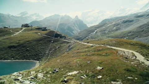 Swiss Alps Mountain Captured in Bright Daylight with Iconic Sharp Sum Stock Footage 316044064