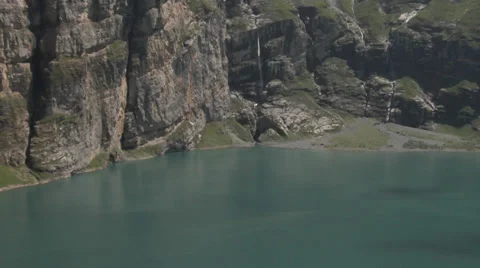 Swiss Alps - mountain stream flows into the lake. 動画素材 32212259