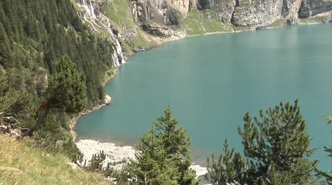 Swiss Alps - mountain stream flows into the lake. Stock Footage 32215008