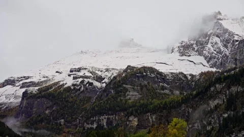 Swiss Alps snow background time-lapse. snowy mountains and clouds passing close Stock Footage 259395722
