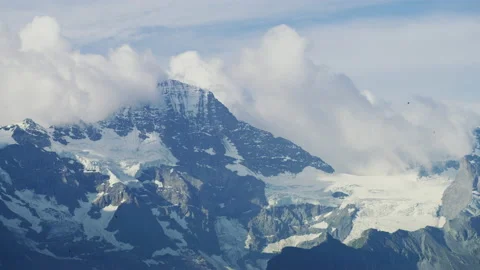 Swiss Alps under a cloudy sky Stock Footage 219084091