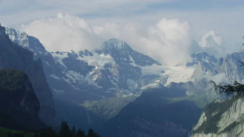 Swiss Alps under a cloudy sky Stock Footage 219758418