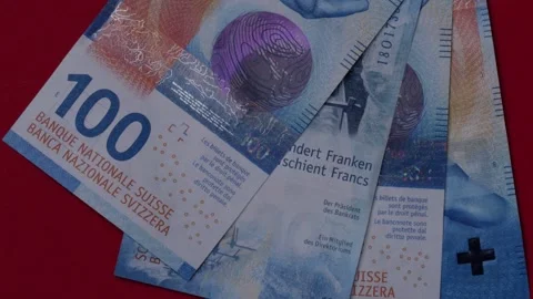 Swiss Banknotes Are Falling On A Red Background. Stock Footage 143566626