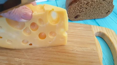 Swiss cheese knife cuts slow motion Video stock 88000853