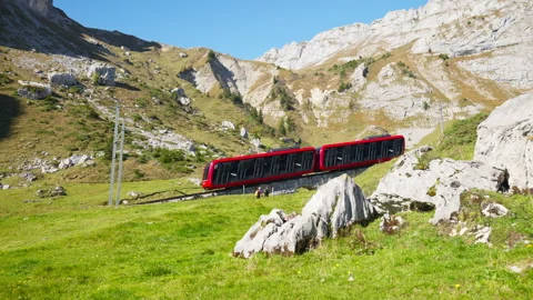 Swiss cogwheel train moving up the mountain Stock Footage 319844340