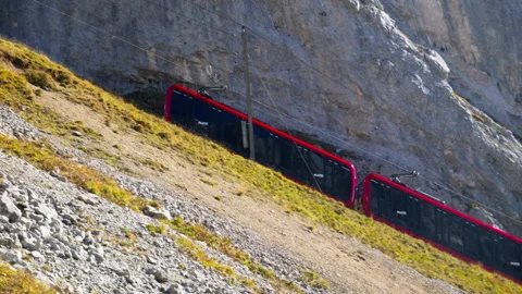 Swiss cogwheel train moving up the mountain Stock Footage 319844373