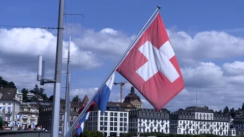 Swiss flag fluttering in the wind in Lucerne Stock Footage 114821181