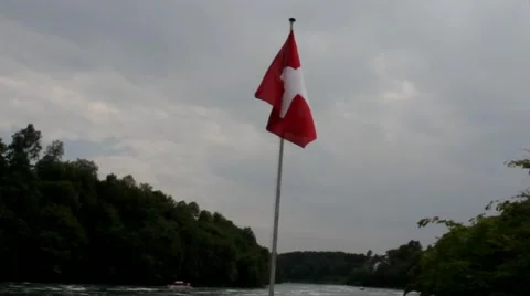 Swiss flag flying at the boat floating on  Rhine Stock-Footage 42016337