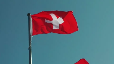 A Swiss flag is flying Stock Footage 343407655