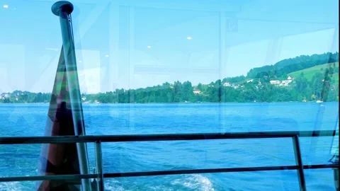 Swiss Flag on a Passenger Ship with Window Reflection in a Sunny Summer Day Stockbeeldmateriaal 201597276