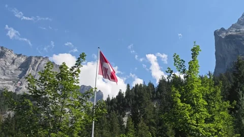 Swiss Flag Surrounded By Giant Towering Mountain Peaks In Schwarzwaldalp Stock Footage 346603452