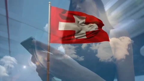 Swiss flag waving with person using smartphone against cloudy sky background Stock Footage 328303983