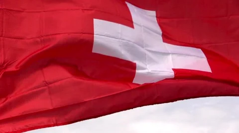 Swiss flag in the wind in sunlight Stock Footage 40340603