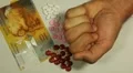 Swiss Franc CHF, Counting Drugs and Money, Health Care, Colorful Pills HD Footage