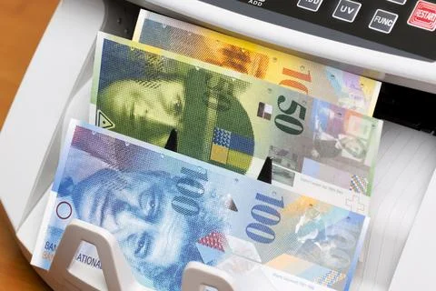 Swiss franc in the counting machine Stock Photos